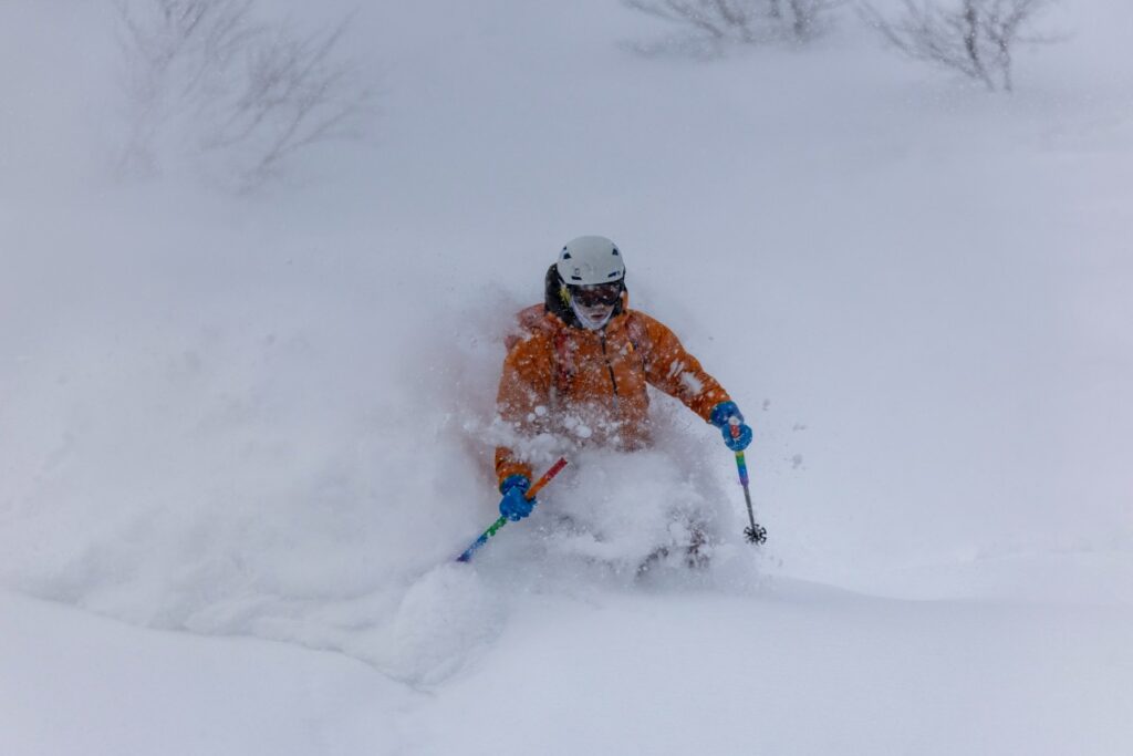 Action skier Japan backcountry ski tour