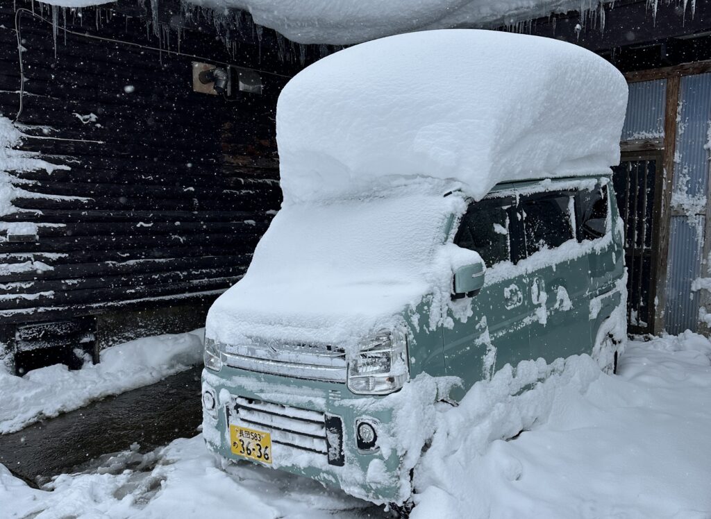 Van buried in another Myoko snowstorm